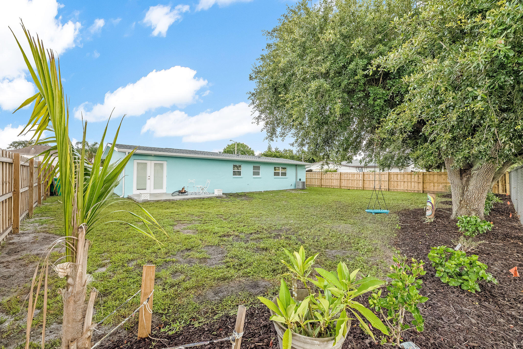 411 4th Street Merritt Island, FL 32953 - Photo 22 of 26 a view of a garden