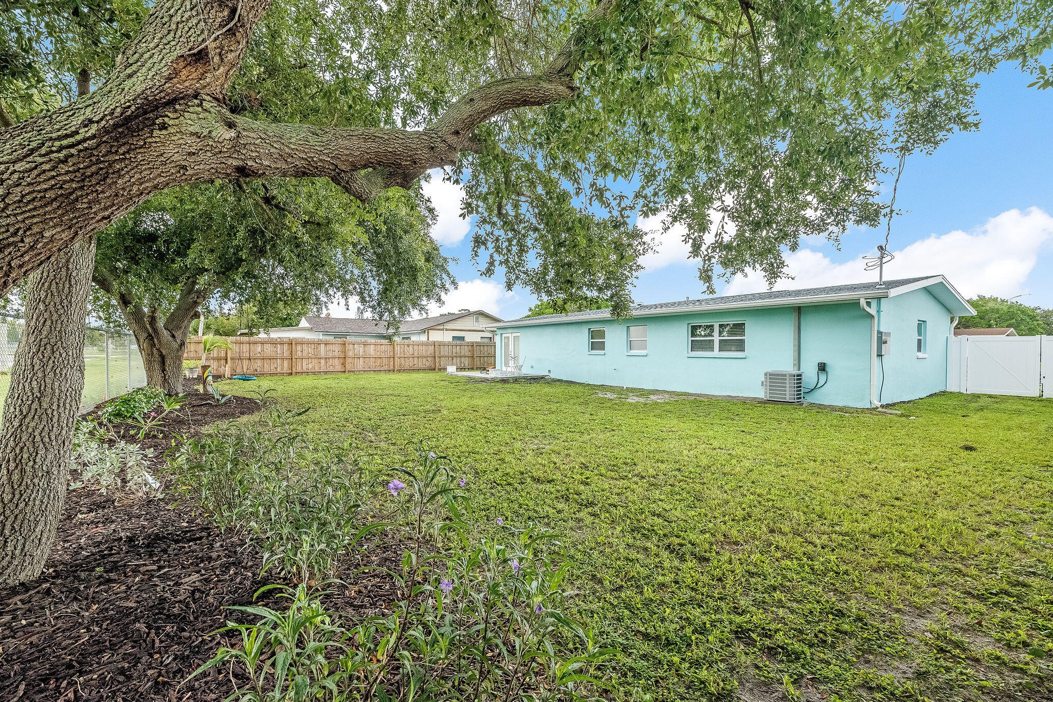 411 4th Street Merritt Island, FL 32953 - Photo 23 of 26 a view of a house with a yard