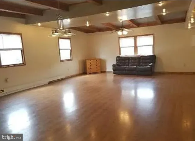 a view of a livingroom with wooden floor