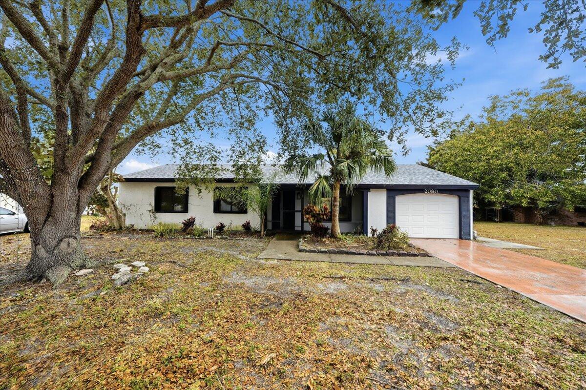 2080 Southeast Triumph Road Port St. Lucie, FL 34952 - Photo 2 of 33 Front