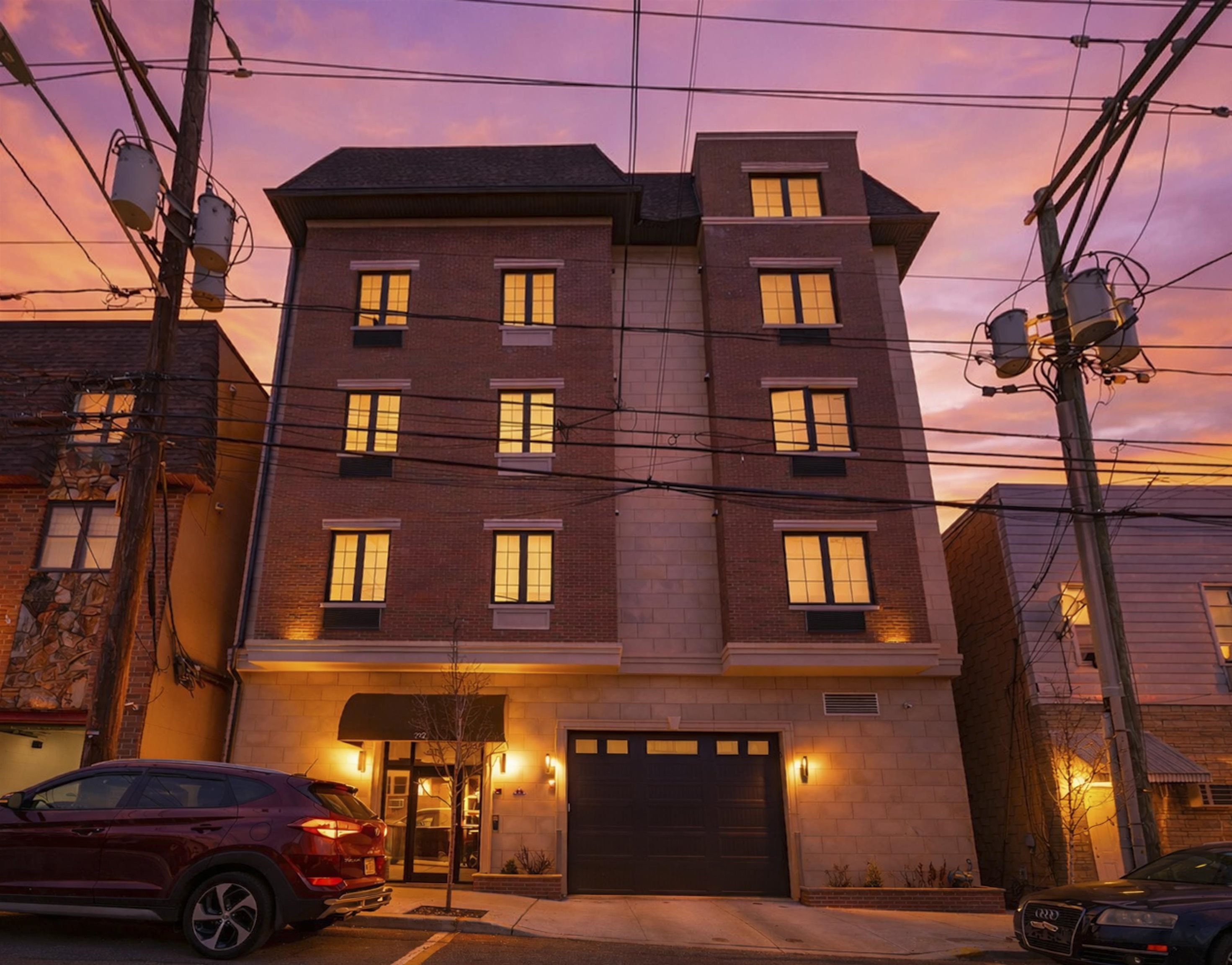a front view of a building with parking space