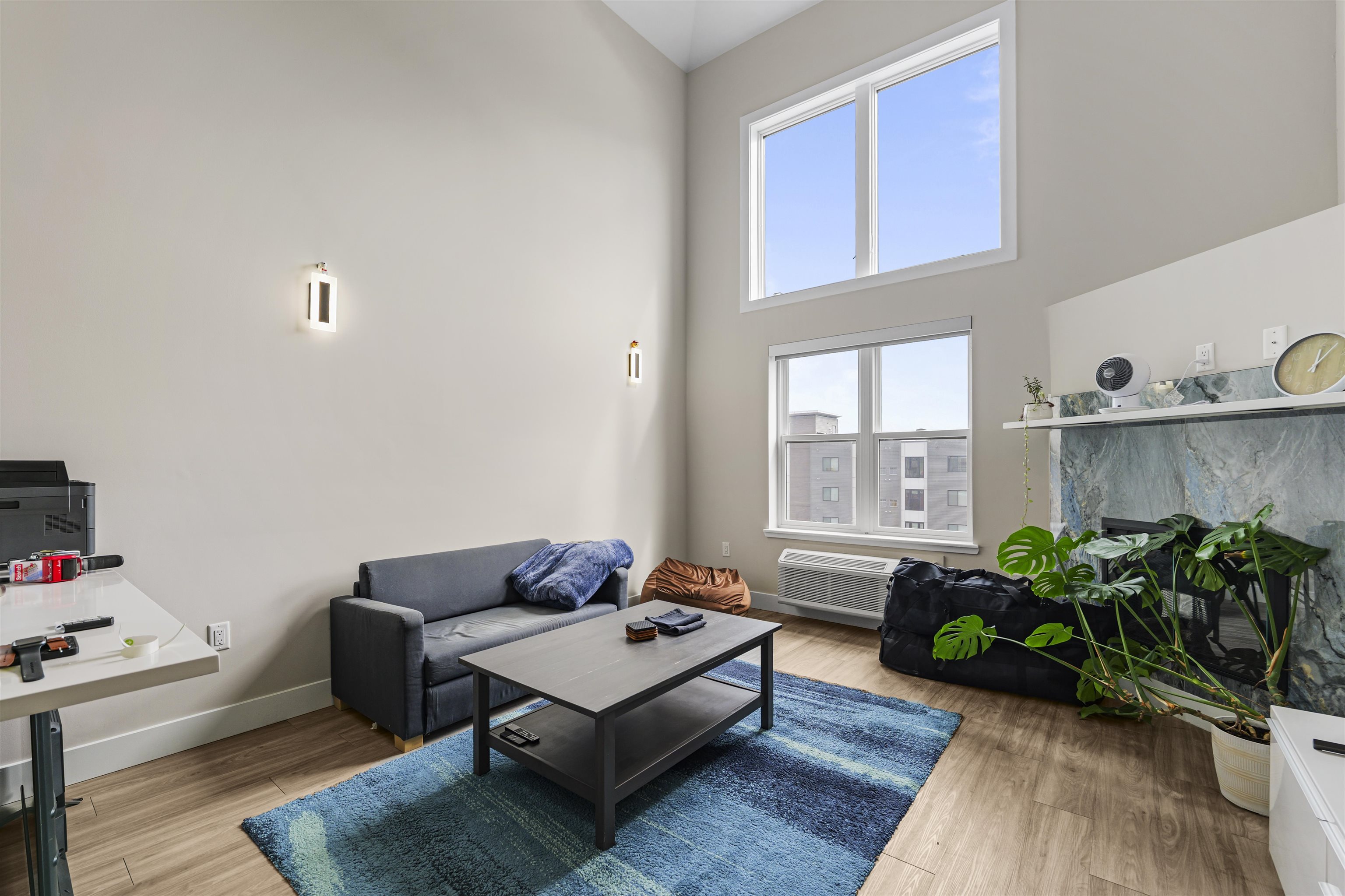 212 70th Street, Unit 404 Guttenberg, NJ 07093 - Photo 5 of 14 a living room with furniture and a potted plant