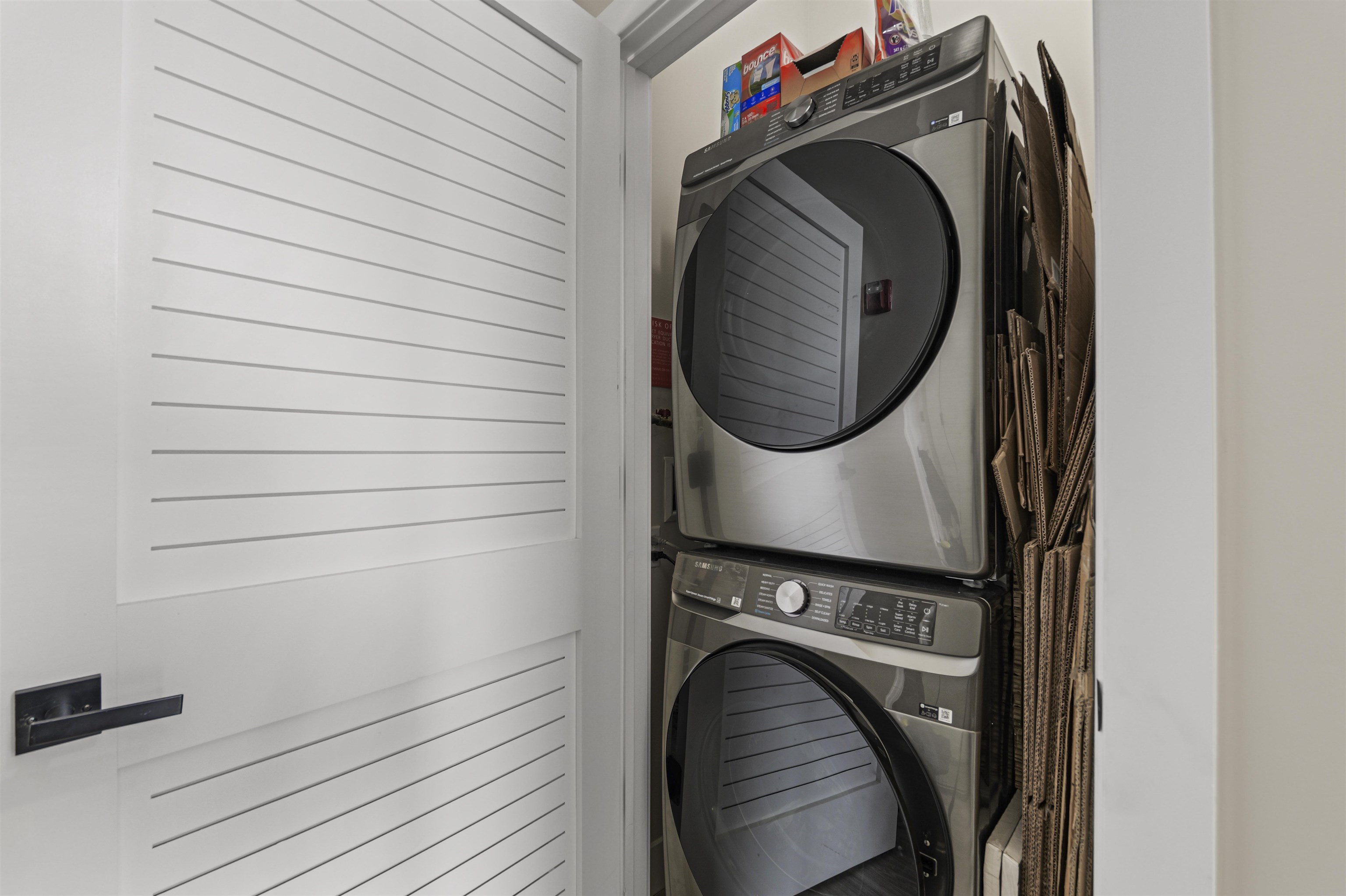 212 70th Street, Unit 404 Guttenberg, NJ 07093 - Photo 8 of 14 a utility room with dryer and washer