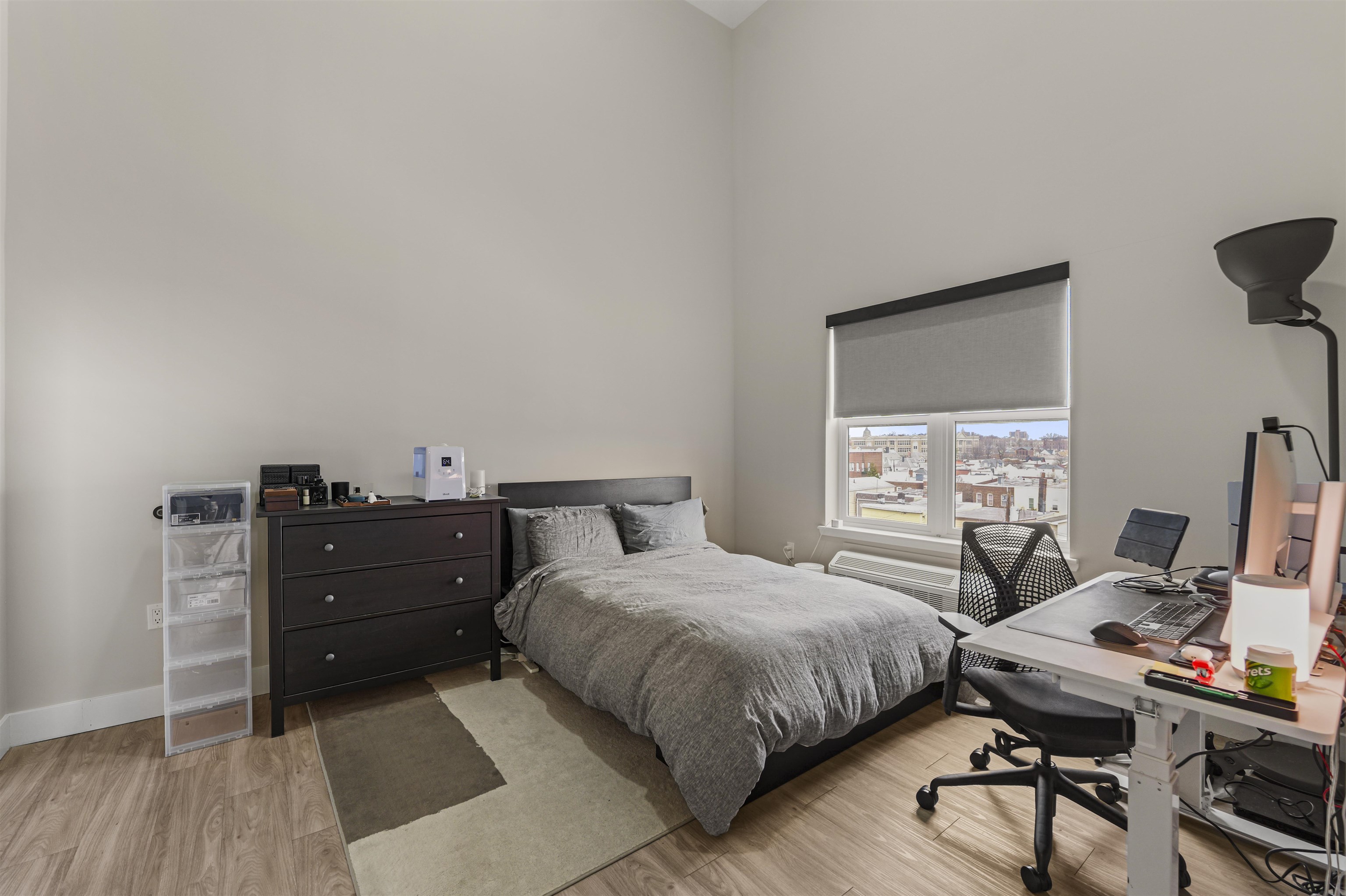 212 70th Street, Unit 404 Guttenberg, NJ 07093 - Photo 10 of 14 a bedroom with a bed and a desk