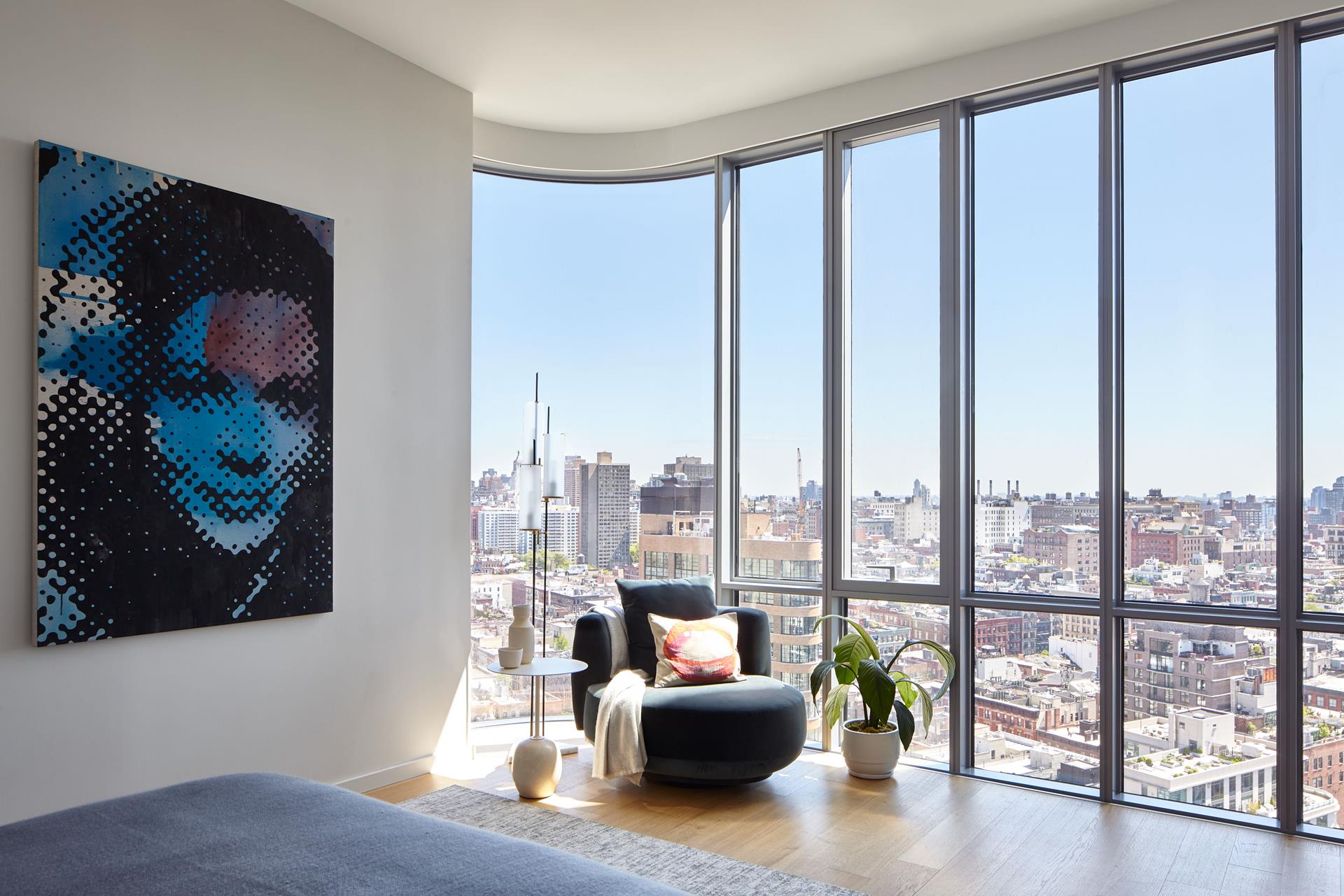 565 Broome Street, Unit S23B Manhattan, NY 10013 - Photo 7 of 9 a living room with furniture and floor to ceiling windows