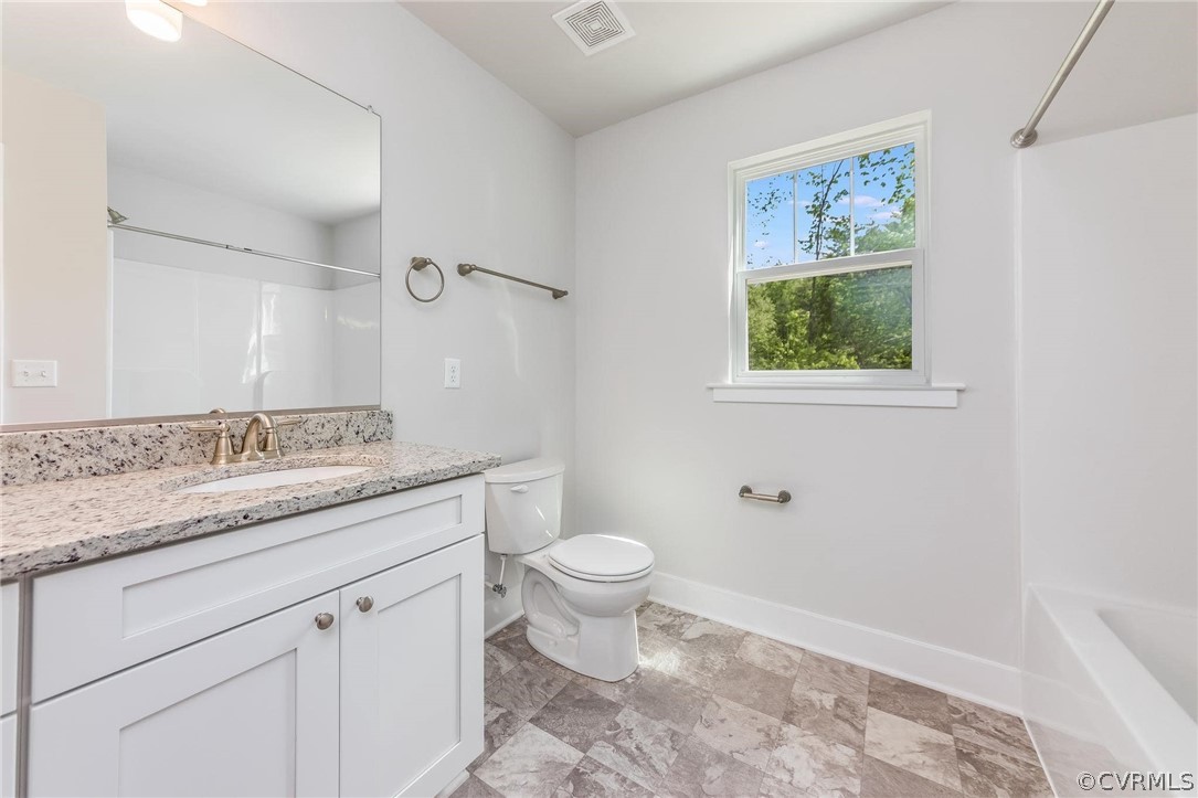101 Indian Hills Road Locust Grove, VA 22508 - Photo 21 of 36 a bathroom with a granite countertop toilet sink and mirror
