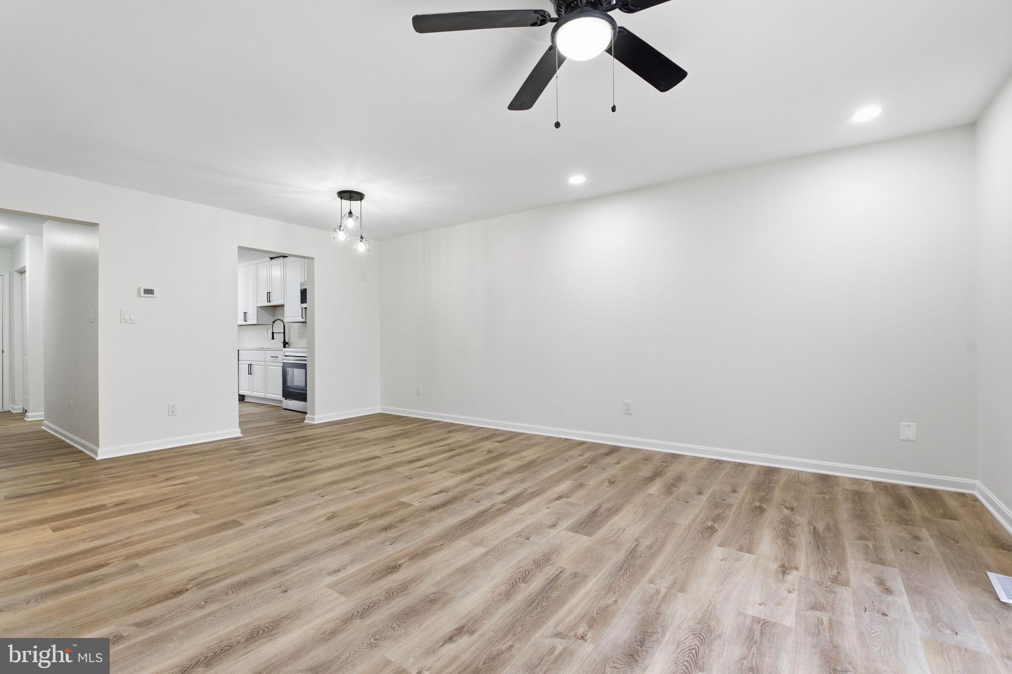629 Nollmeyer Road Middle River, MD 21220 - Photo 11 of 35 a view of an empty room with wooden floor