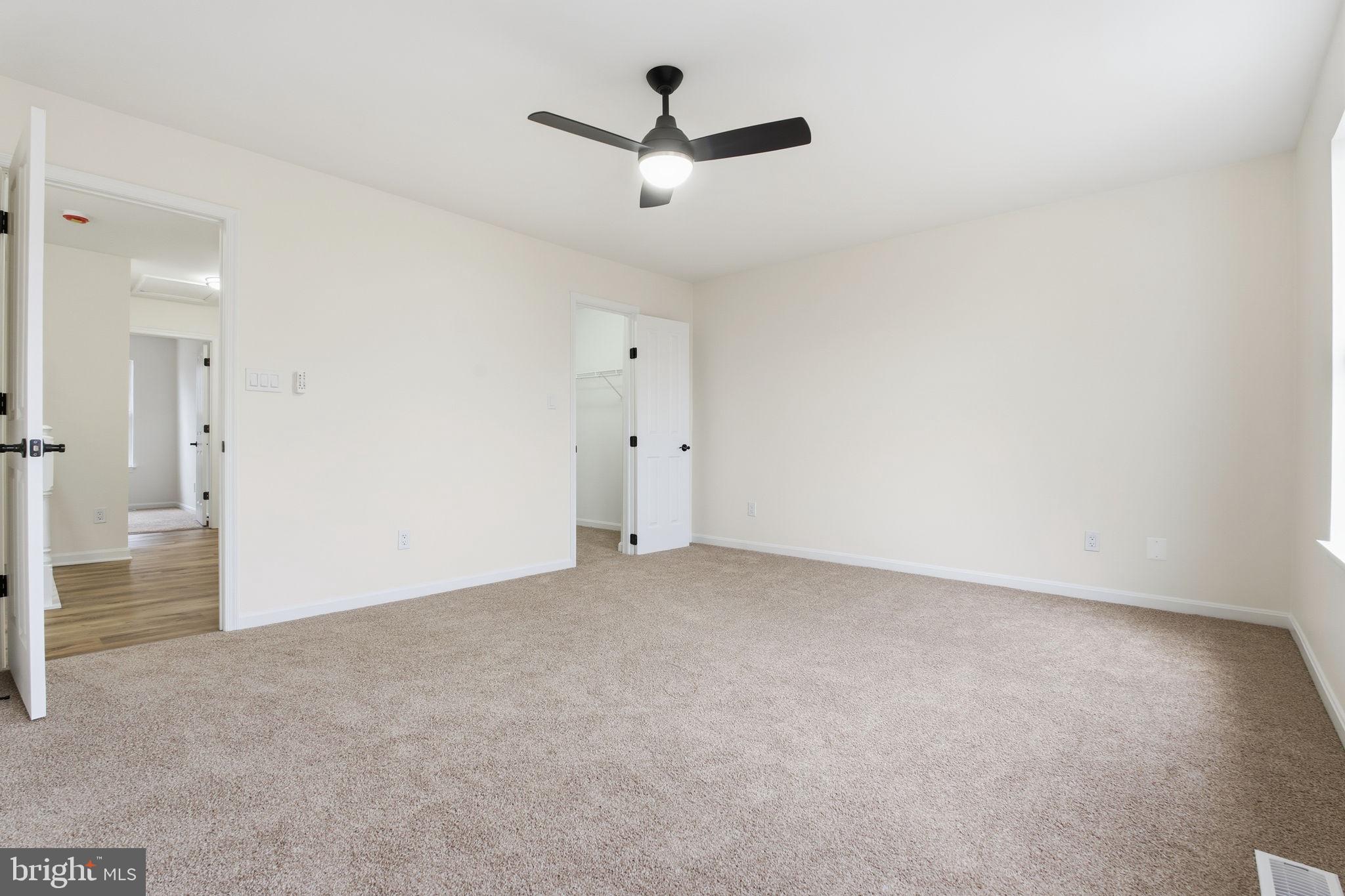 629 Nollmeyer Road Middle River, MD 21220 - Photo 23 of 35 an empty room with a ceiling fan and a window