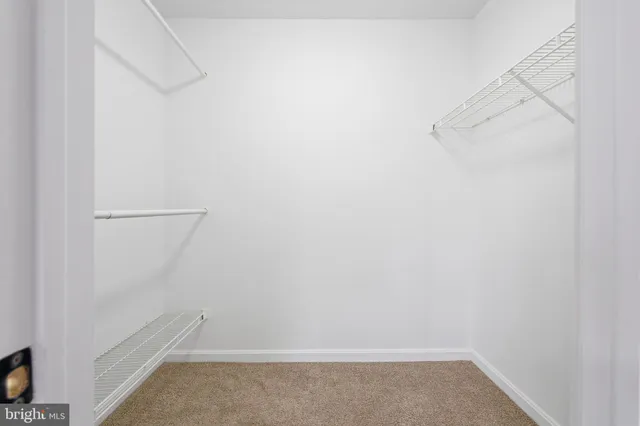 a view of an empty walk in closet