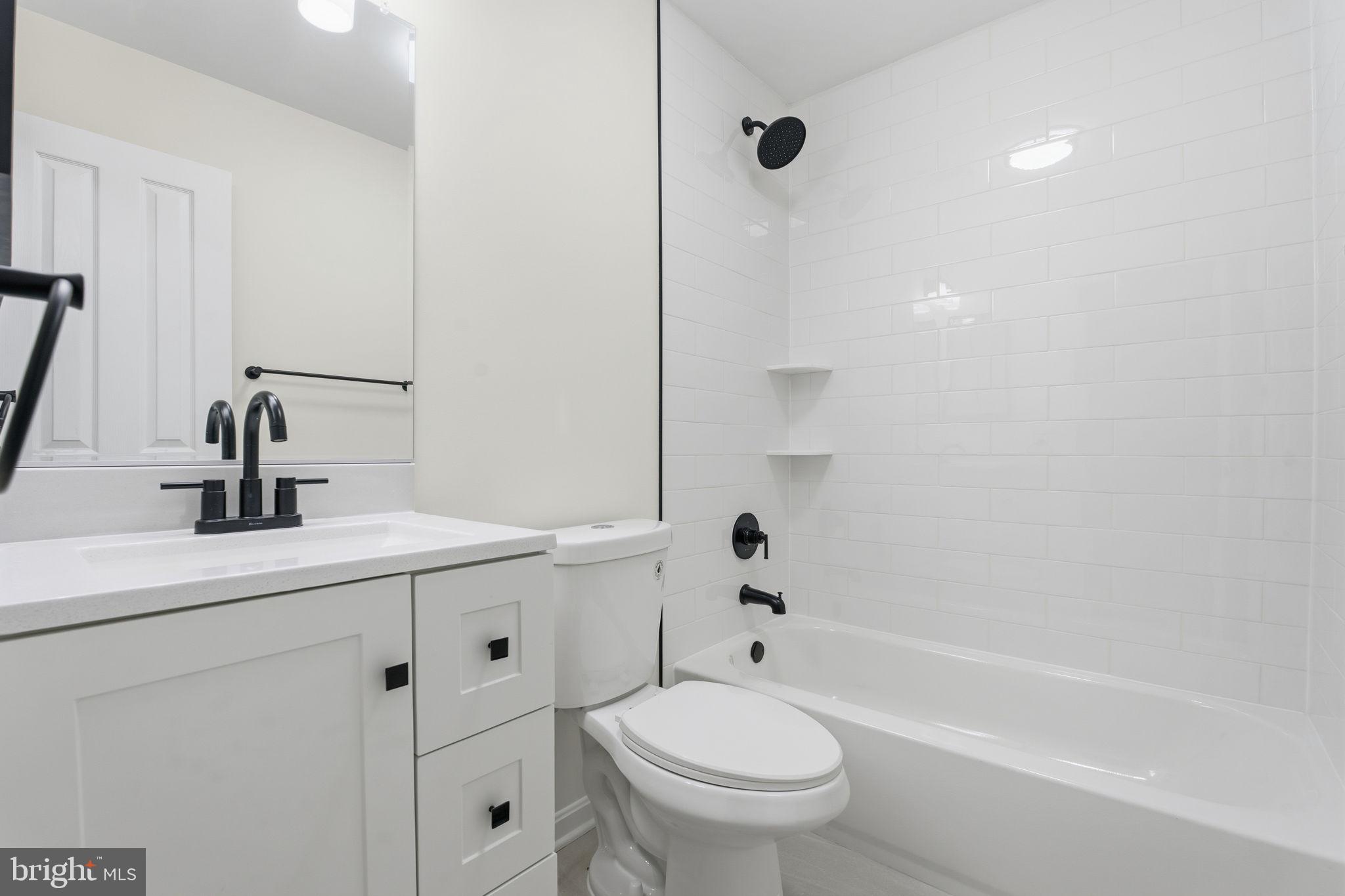 629 Nollmeyer Road Middle River, MD 21220 - Photo 33 of 35 a bathroom with a sink a toilet and a bathtub