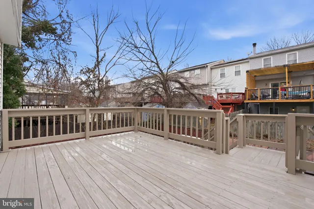a view of a house with wooden deck