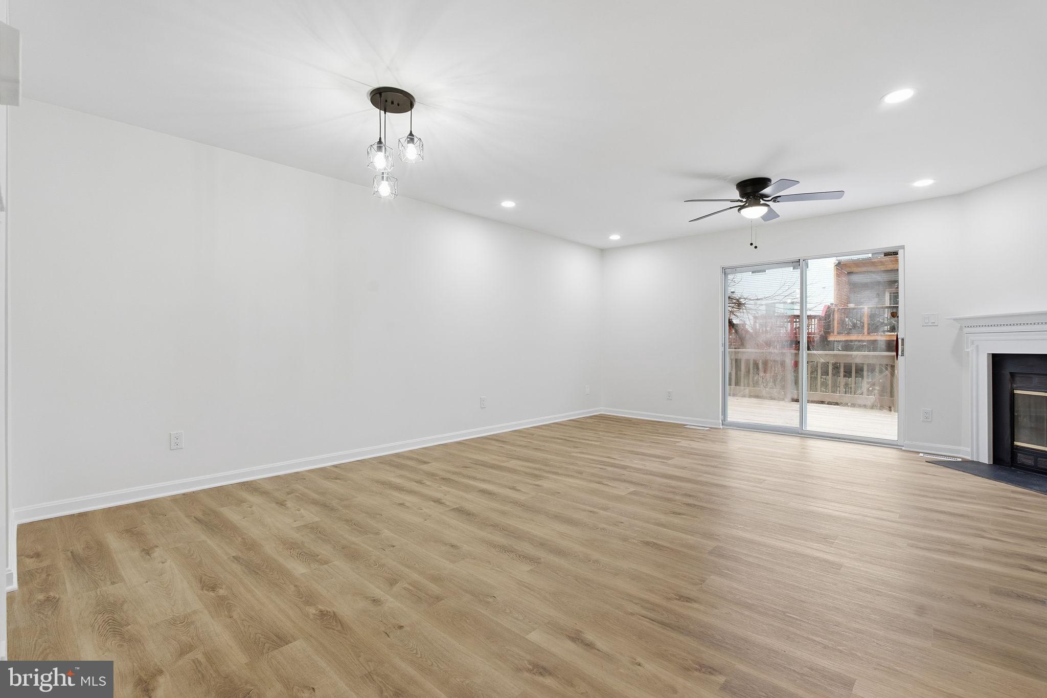 629 Nollmeyer Road Middle River, MD 21220 - Photo 6 of 35 an empty room with wooden floor and windows