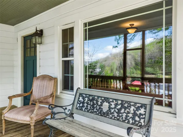 a view of a two chairs in the balcony