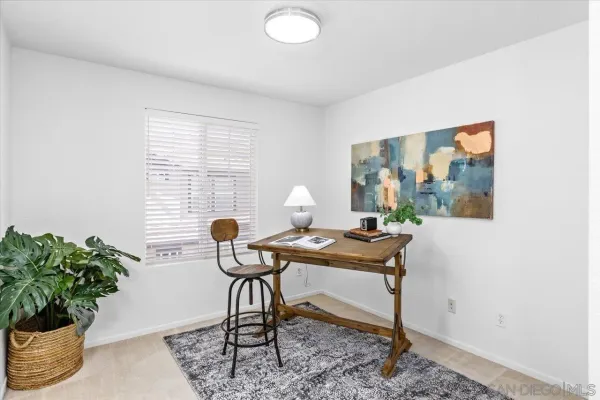 a view of a workspace with furniture