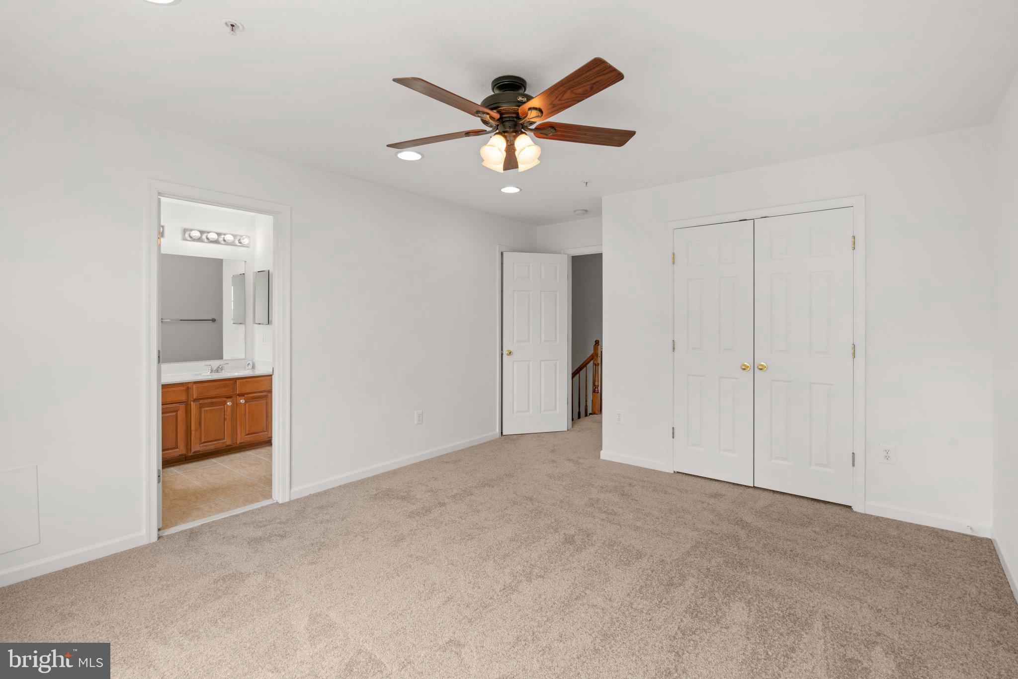 887 Middle River Road Middle River, MD 21220 - Photo 22 of 42 a view of an empty room with a ceiling fan
