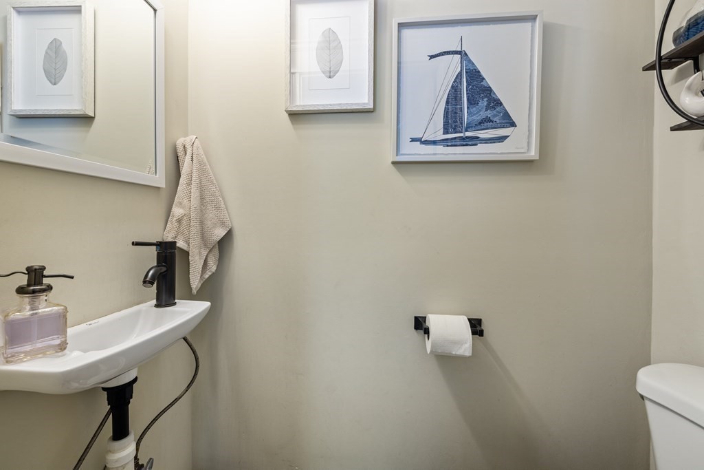 35 Jackson Street Saugus, MA 01906 - Photo 14 of 26 a bathroom with a toilet and a sink