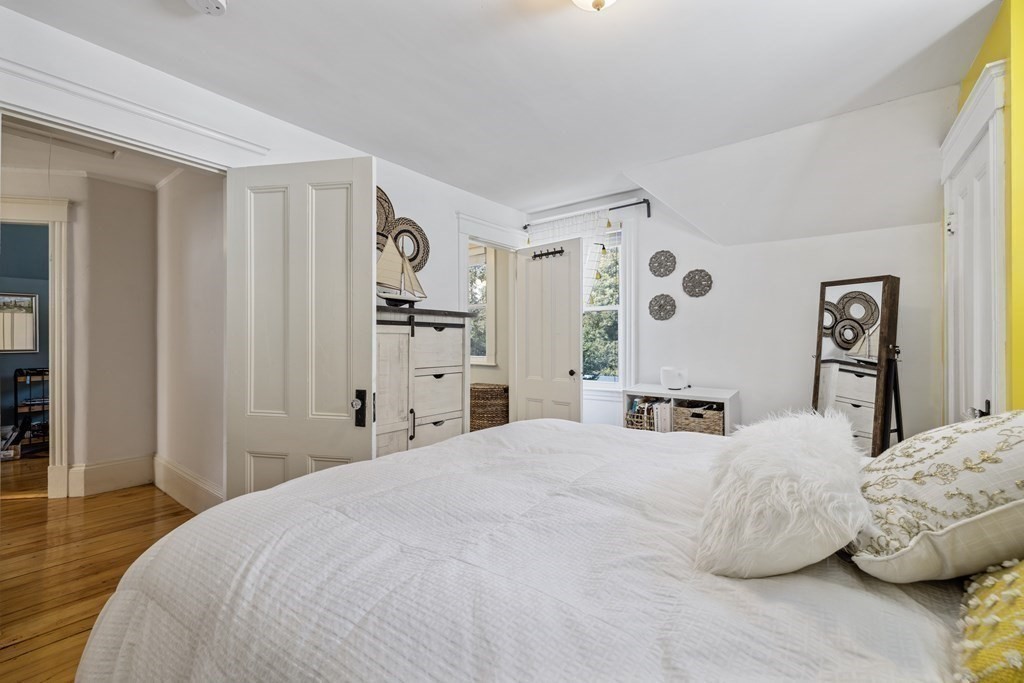 35 Jackson Street Saugus, MA 01906 - Photo 21 of 26 a bedroom with a bed and a window