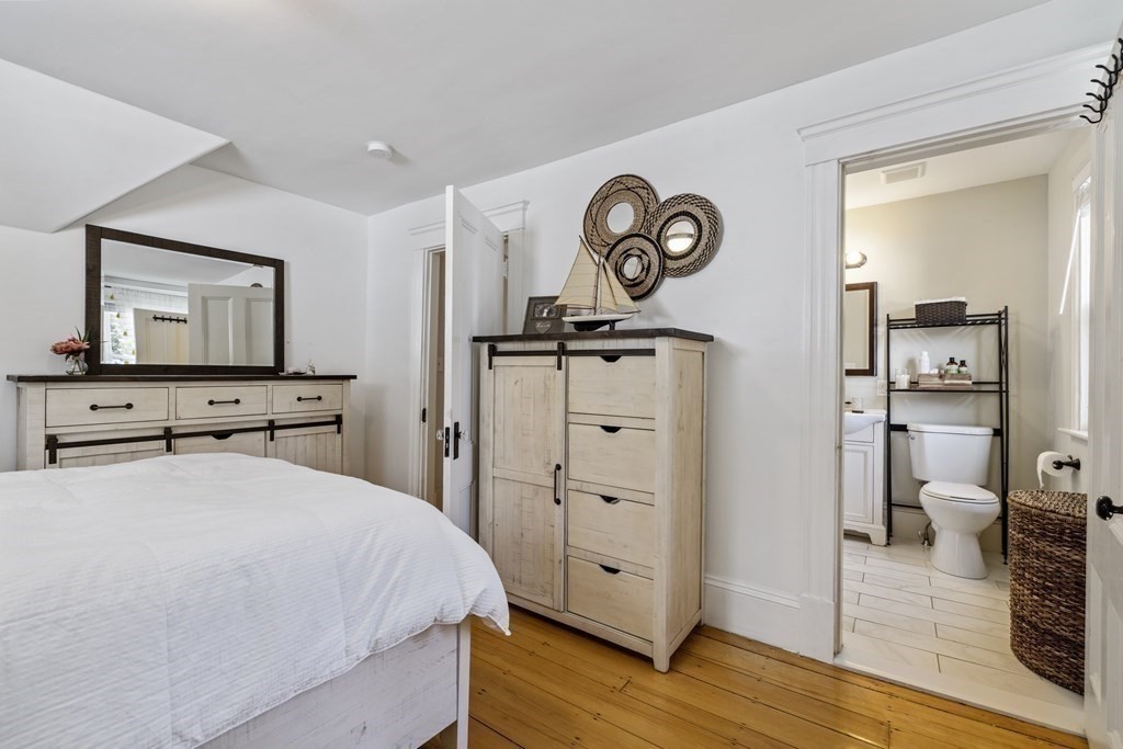 35 Jackson Street Saugus, MA 01906 - Photo 22 of 26 a bedroom with a bed and a view of bathroom