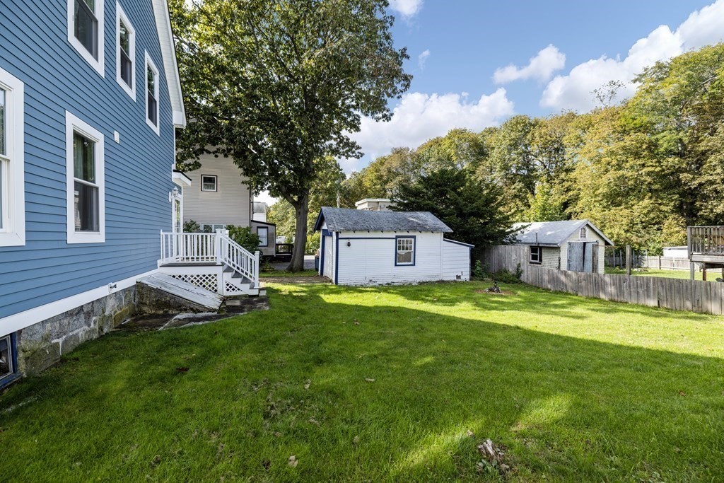 35 Jackson Street Saugus, MA 01906 - Photo 25 of 26 a view of a chairs in a yard with wooden fence