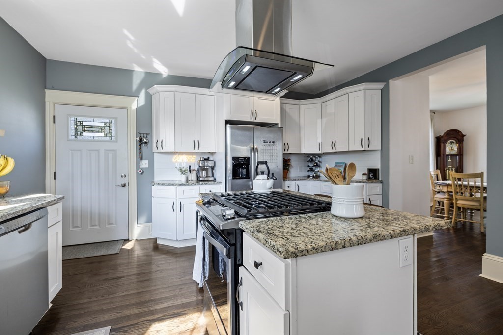 35 Jackson Street Saugus, MA 01906 - Photo 10 of 26 a kitchen with stainless steel appliances granite countertop a sink stove and refrigerator
