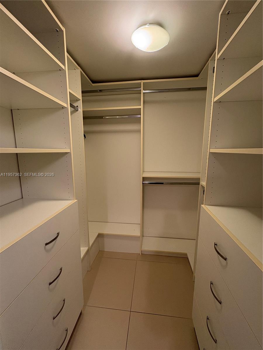 1865 Brickell Avenue, Unit A810 Miami, FL 33129 - Photo 20 of 24 a view of walk in closet with empty racks