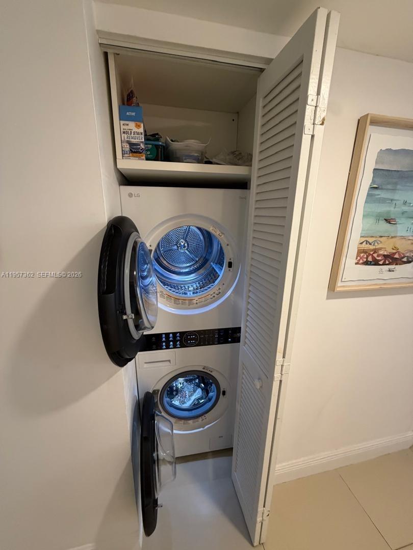 1865 Brickell Avenue, Unit A810 Miami, FL 33129 - Photo 10 of 24 a utility room with dryer and washer