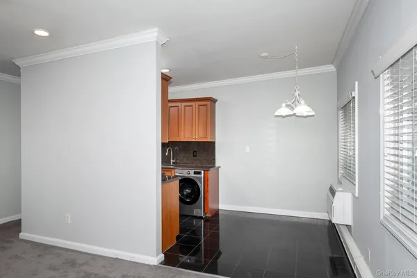 a view of a storage & utility room with a window