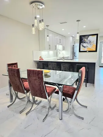 a bathroom with a sink vanity and mirror