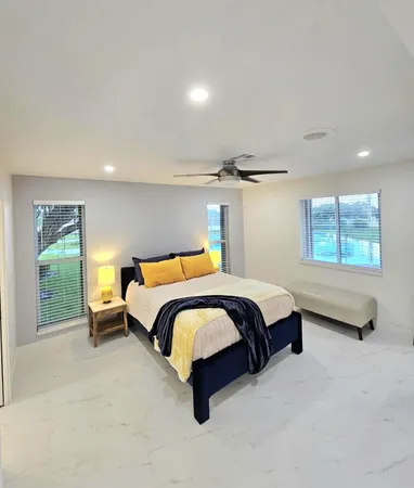 a bedroom with bed and a couch