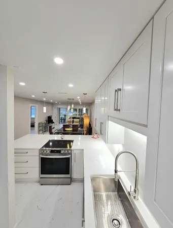 a kitchen with a table and chairs in it