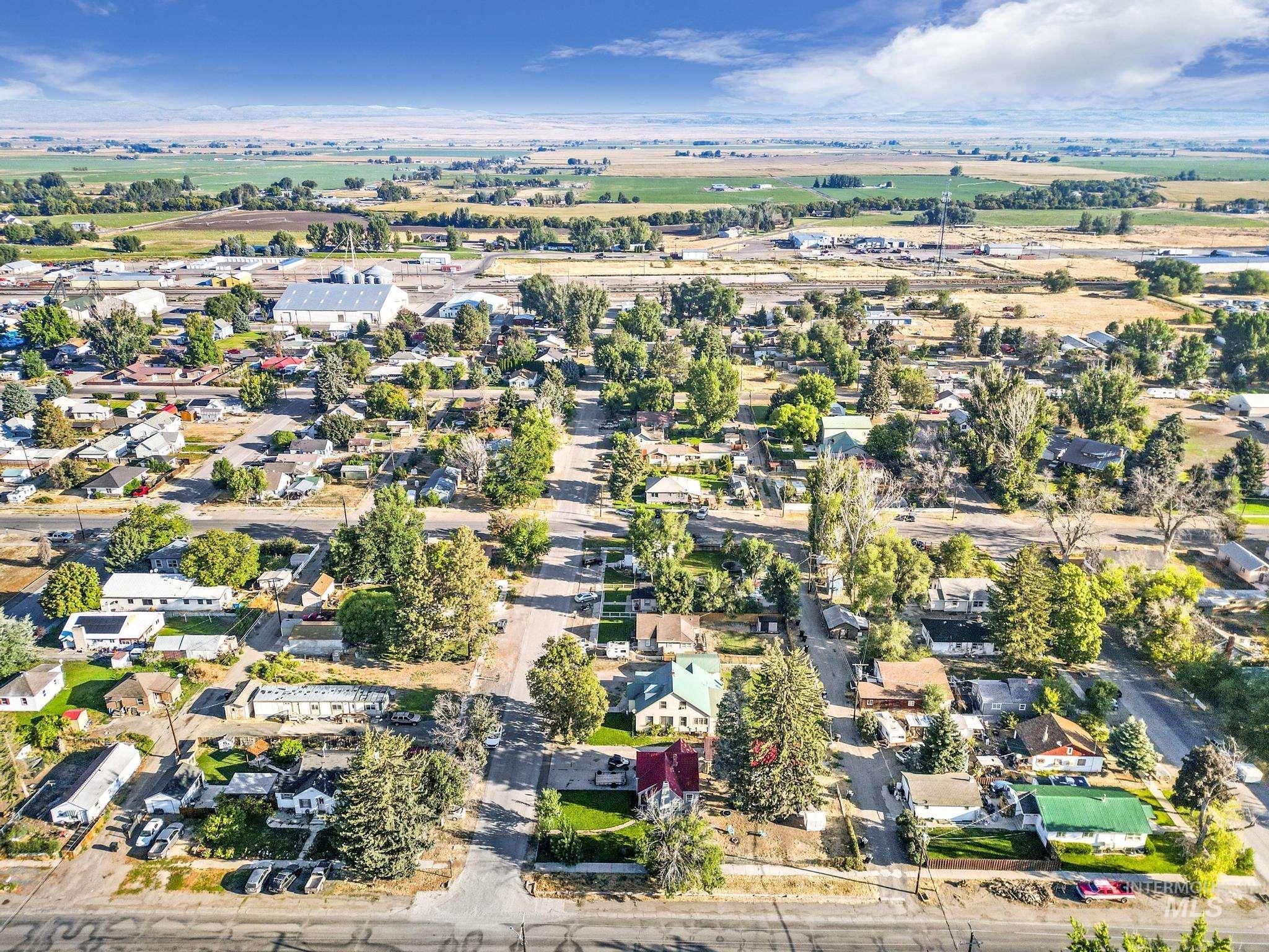 602 4th Avenue East Gooding, ID 83330 - Photo 13 of 36 Aerial view of property and surrounding area featuring nearby suburban area