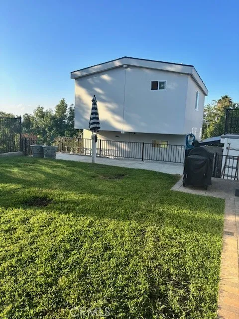 26173 Abdale Street Newhall, CA 91321 - Photo 1 of 15 a view of a back yard of the house
