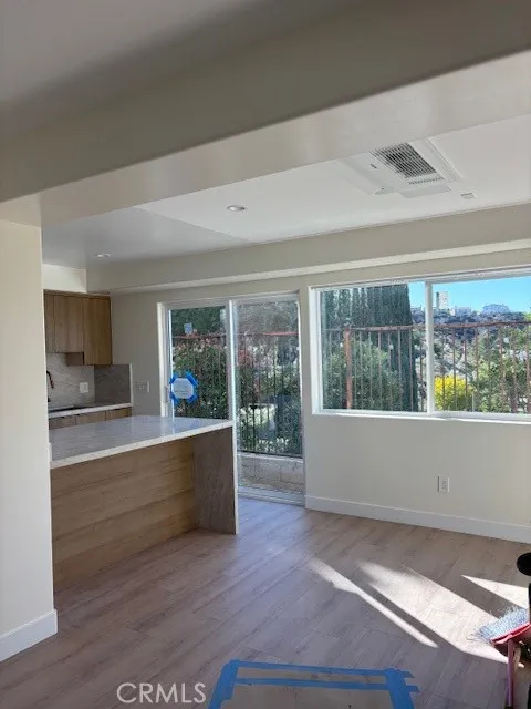 26173 Abdale Street Newhall, CA 91321 - Photo 13 of 15 a living room with wooden floor and a large window
