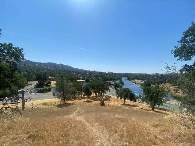 a view of a town with big trees