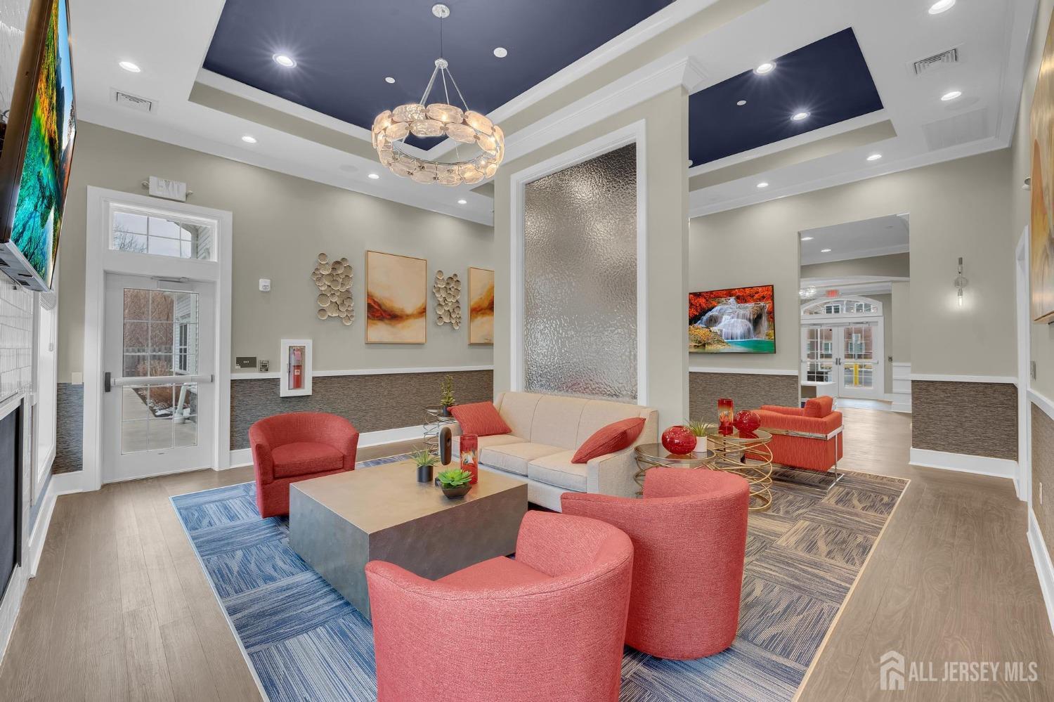 415 Tavern Road Monroe Township, NJ 08831 - Photo 24 of 39 a living room with furniture and a chandelier