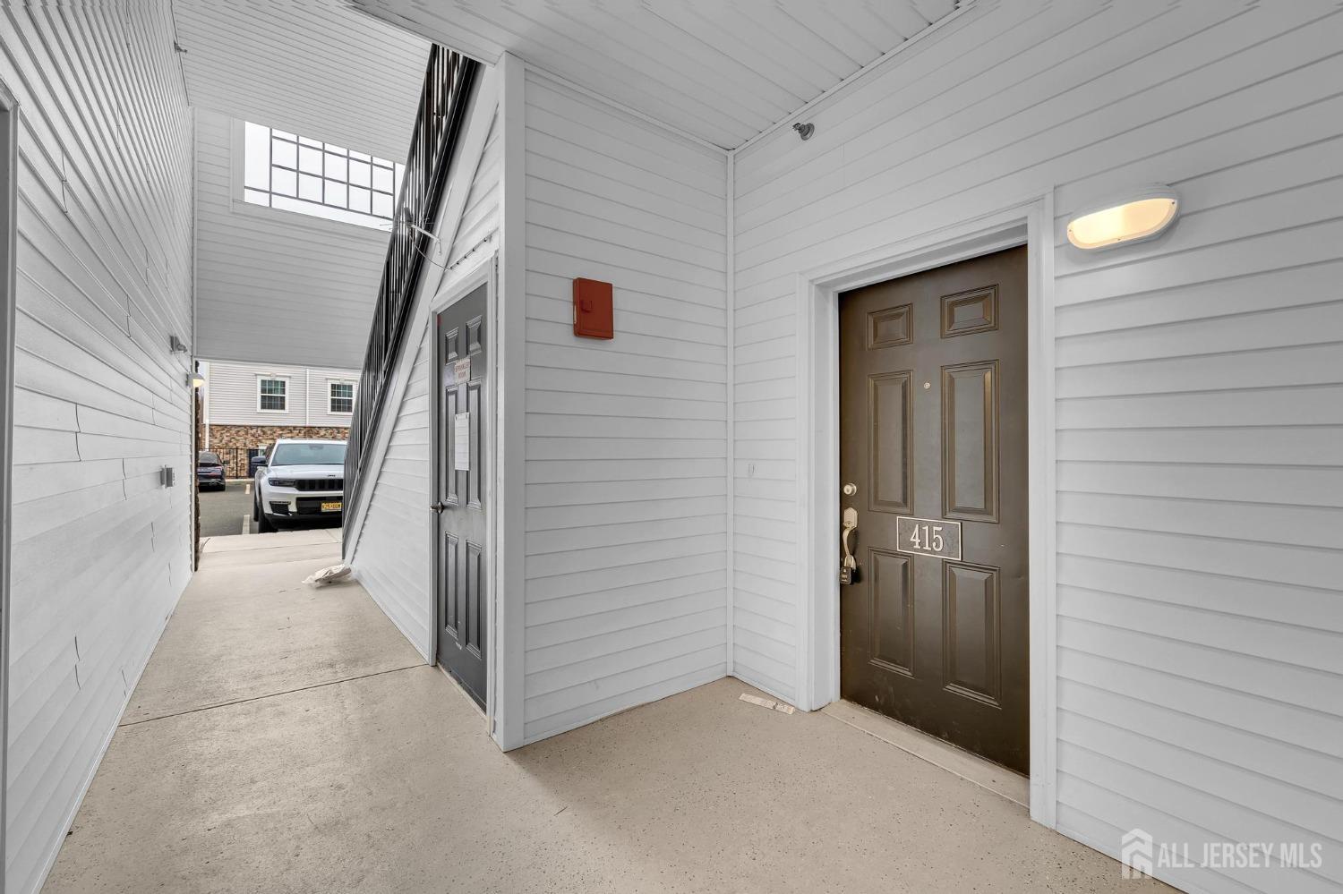 415 Tavern Road Monroe Township, NJ 08831 - Photo 4 of 39 a view of a hallway with closet and entryway