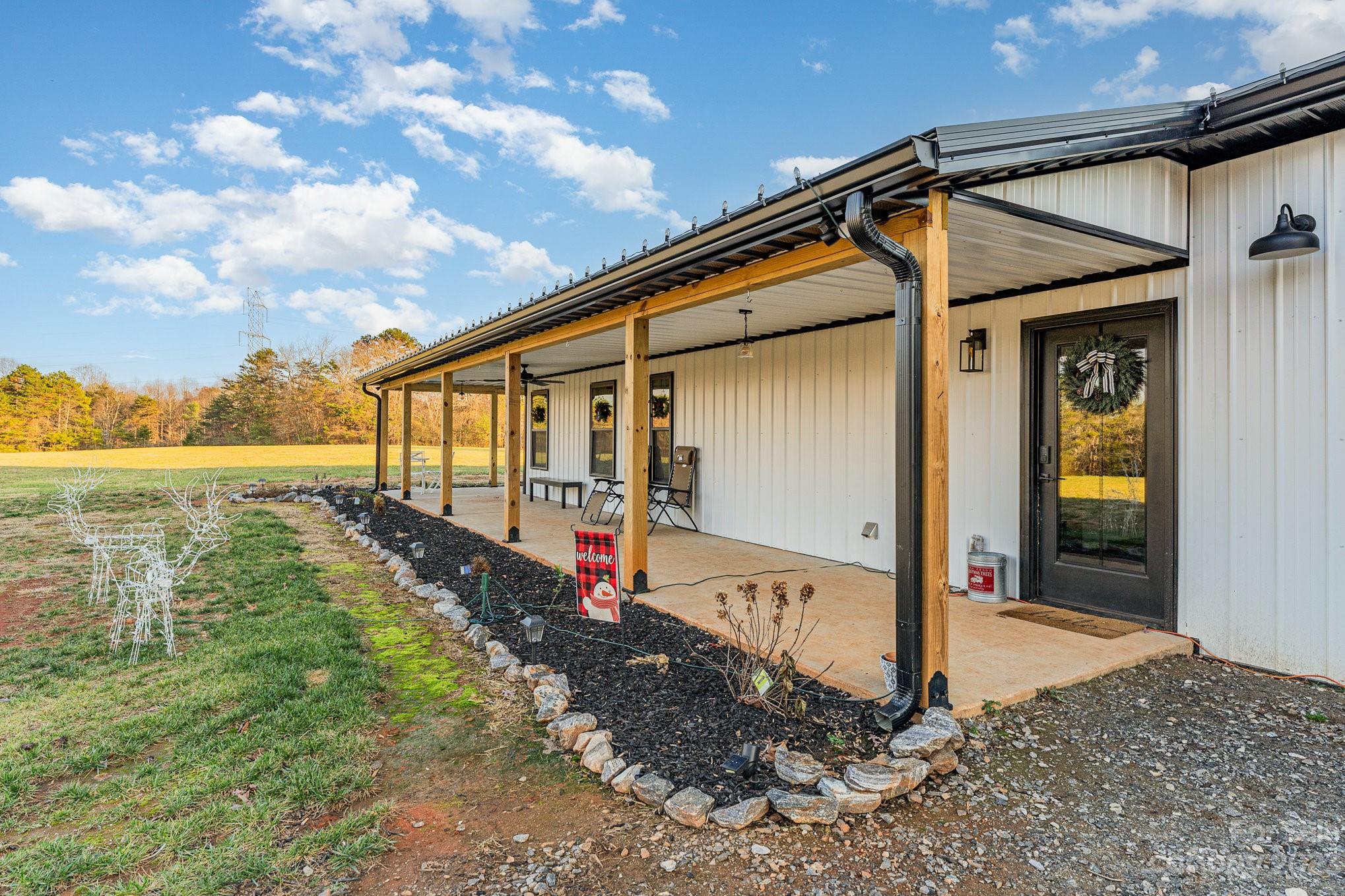 5261 Henderson Road Hamptonville, NC 27020 - Photo 13 of 46 a view of a house with backyard and sitting area