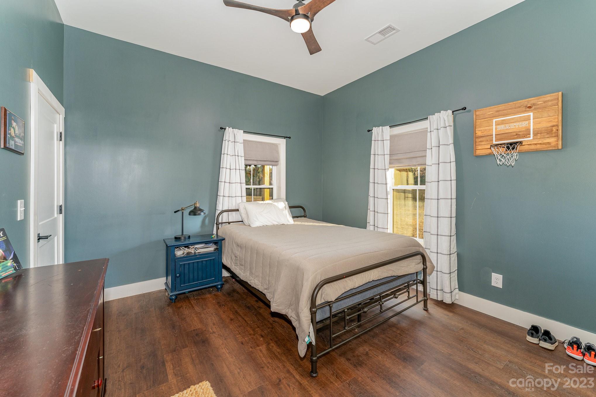5261 Henderson Road Hamptonville, NC 27020 - Photo 14 of 46 a bed room with a bed and a night stand