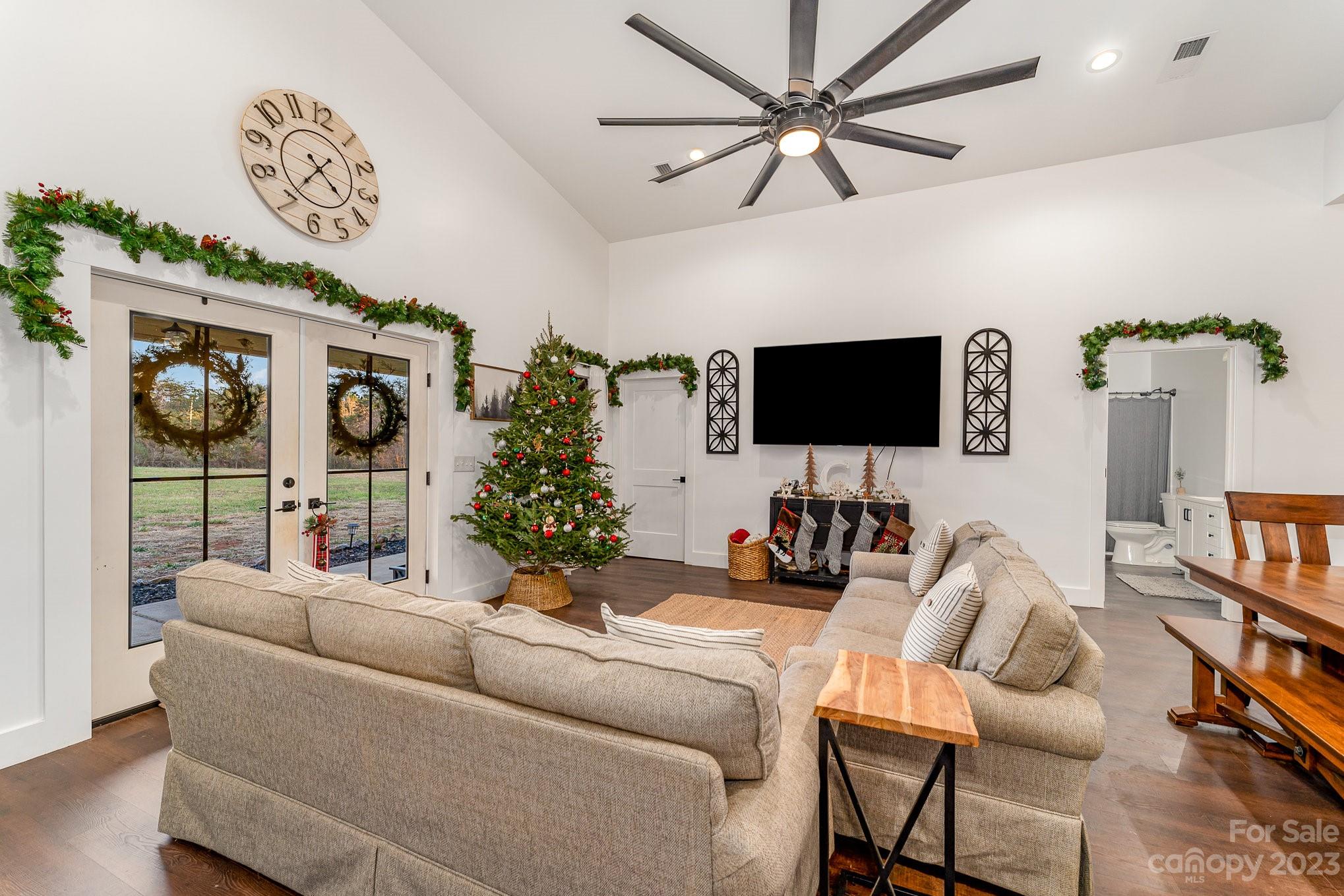 5261 Henderson Road Hamptonville, NC 27020 - Photo 2 of 46 a living room with furniture and a flat screen tv