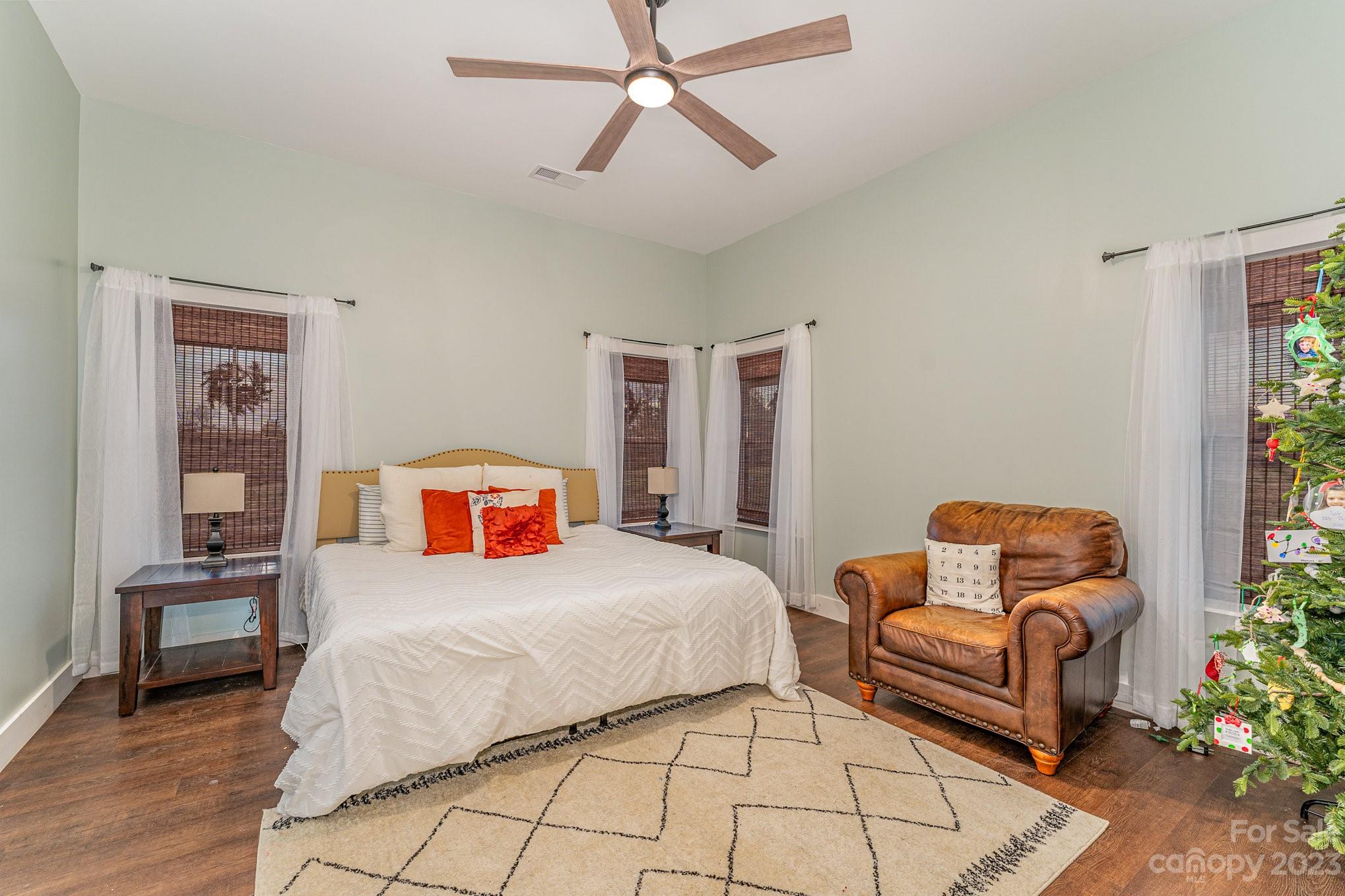 5261 Henderson Road Hamptonville, NC 27020 - Photo 21 of 46 a bedroom with a bed and a couch