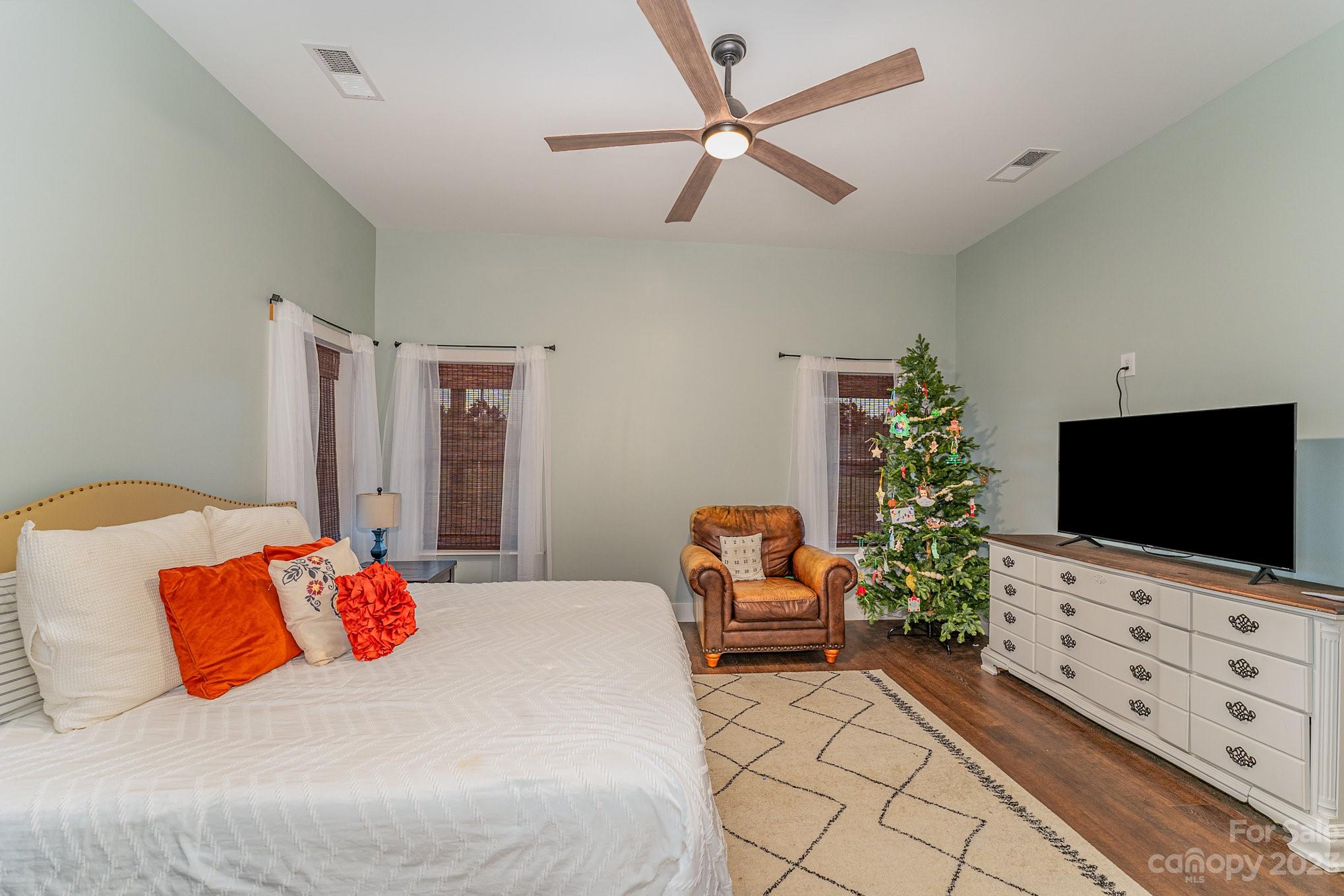 5261 Henderson Road Hamptonville, NC 27020 - Photo 22 of 46 a bedroom with furniture and a flat screen tv