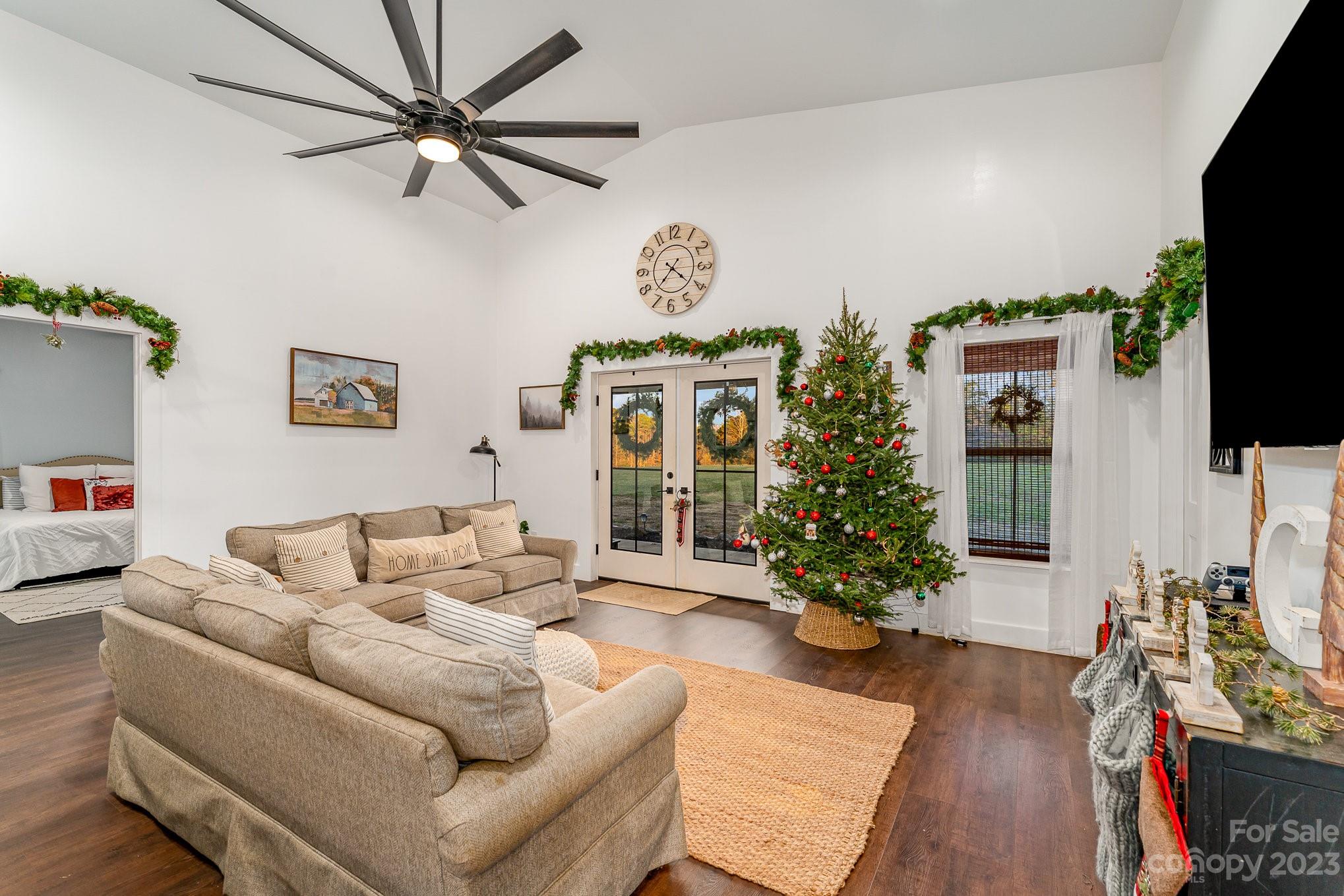 5261 Henderson Road Hamptonville, NC 27020 - Photo 26 of 46 a living room with furniture a flat screen tv and a potted plant