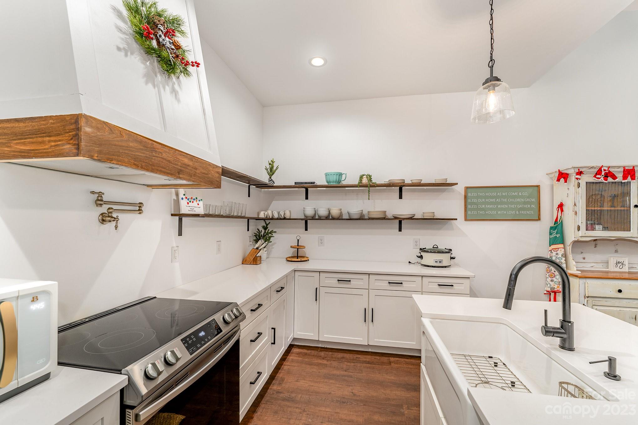 5261 Henderson Road Hamptonville, NC 27020 - Photo 30 of 46 a kitchen with stainless steel appliances granite countertop a sink and cabinets