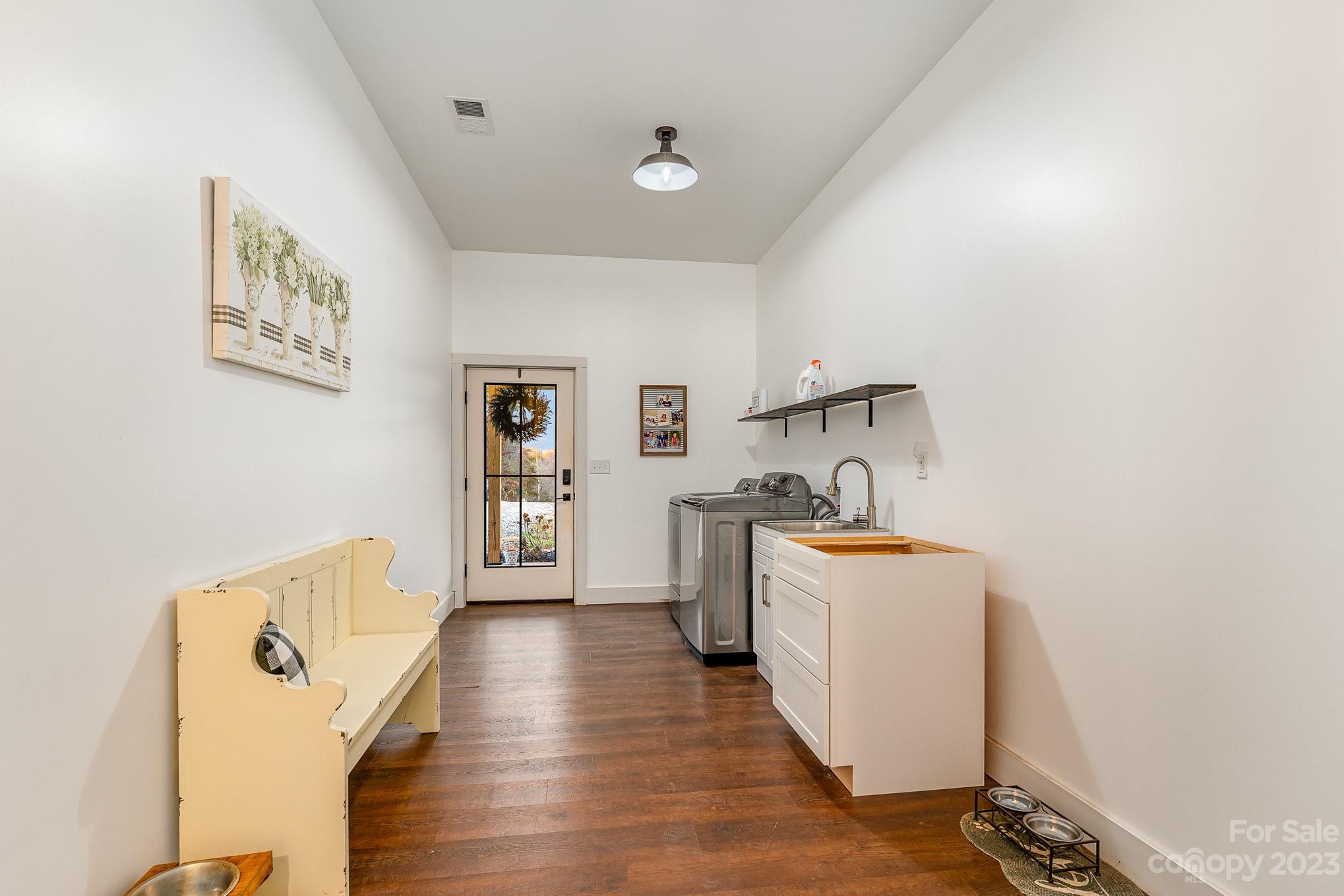 5261 Henderson Road Hamptonville, NC 27020 - Photo 32 of 46 a view of a kitchen with a sink and a stove top oven