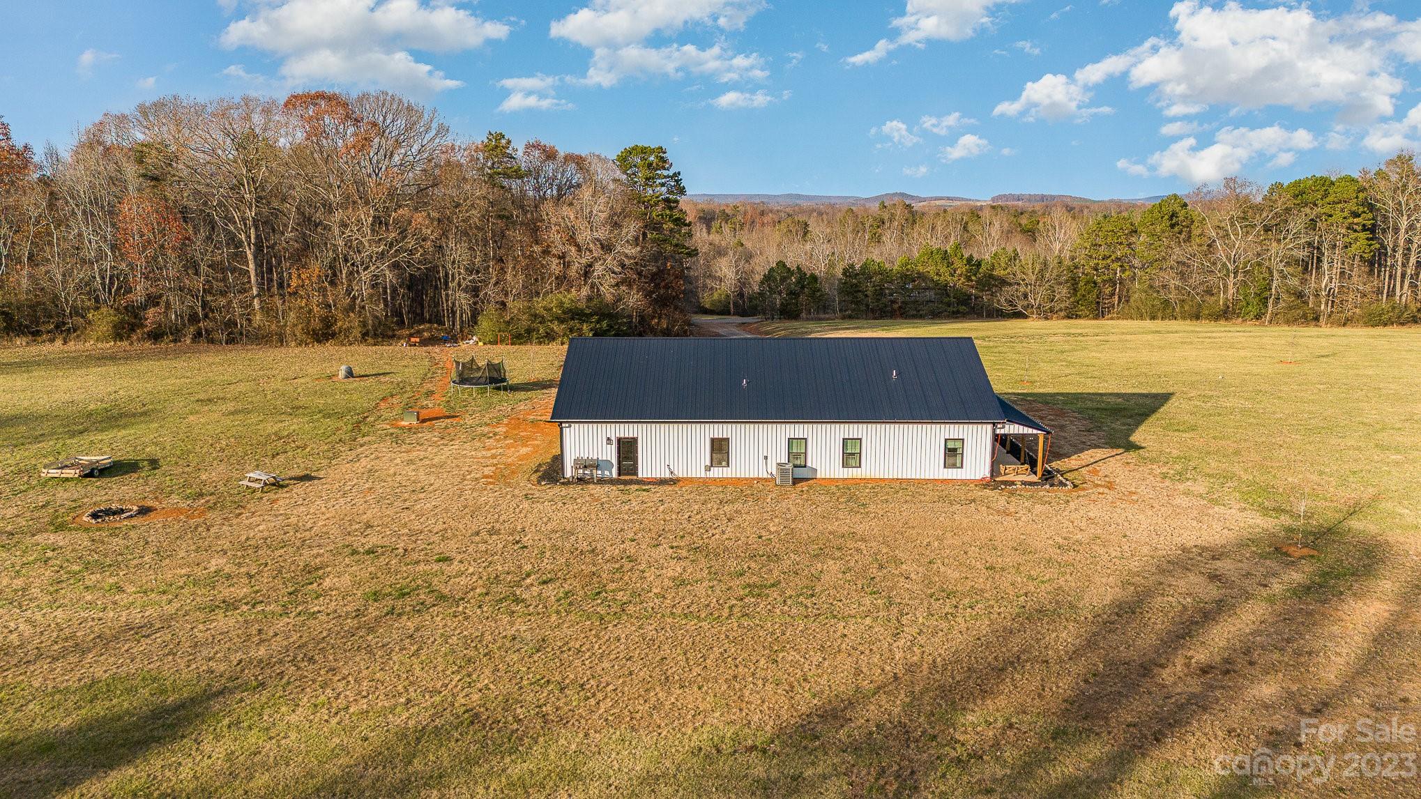 5261 Henderson Road Hamptonville, NC 27020 - Photo 36 of 46 a view of a lake with a mountain in the background
