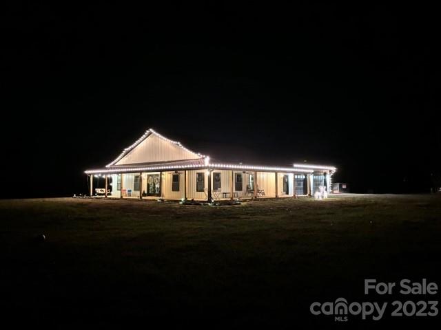 5261 Henderson Road Hamptonville, NC 27020 - Photo 41 of 46 a front view of a house with a garden