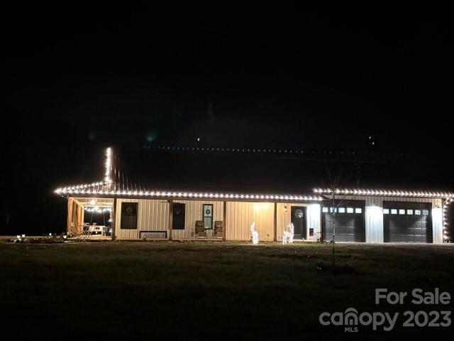 5261 Henderson Road Hamptonville, NC 27020 - Photo 42 of 46 a front view of a house with lots of green space