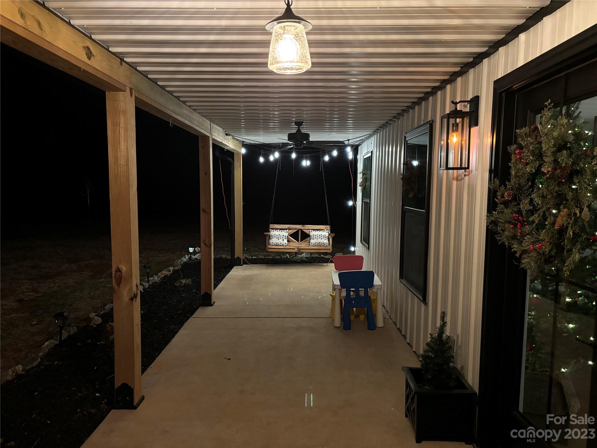 5261 Henderson Road Hamptonville, NC 27020 - Photo 44 of 46 a lobby with furniture and chandelier