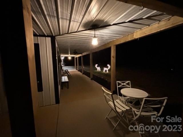 5261 Henderson Road Hamptonville, NC 27020 - Photo 45 of 46 a dining room with furniture and a chandelier
