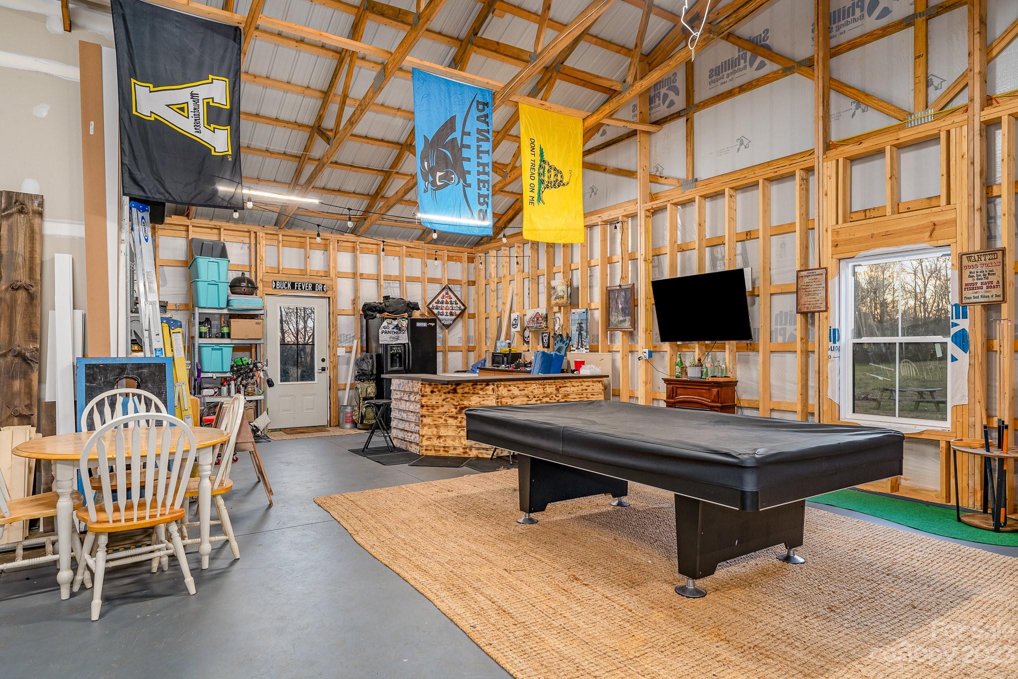 5261 Henderson Road Hamptonville, NC 27020 - Photo 5 of 46 a room with pool table and windows